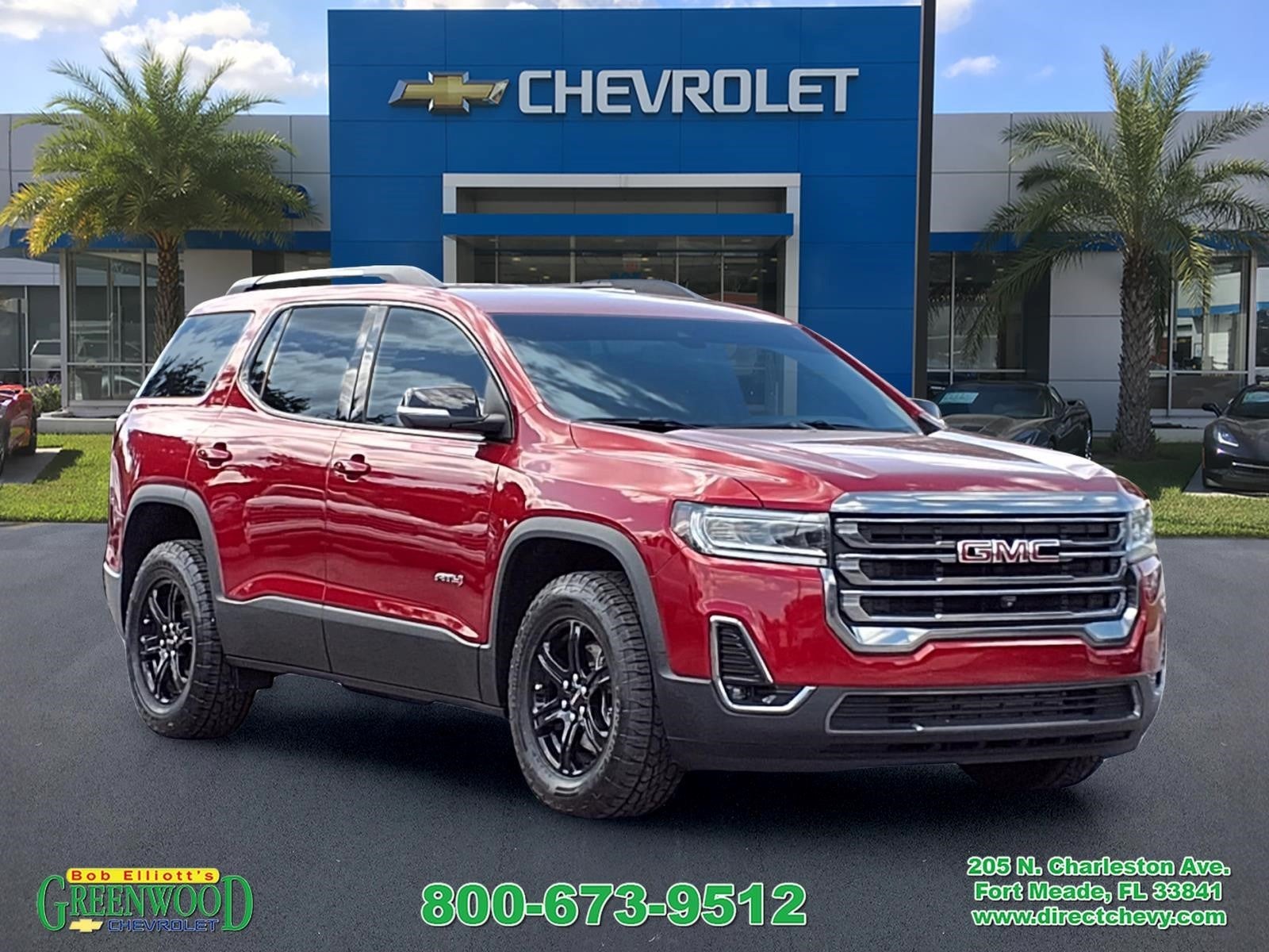 2023 GMC Acadia AT4 in Volcanic Red Tintcoat — front three-quarter view