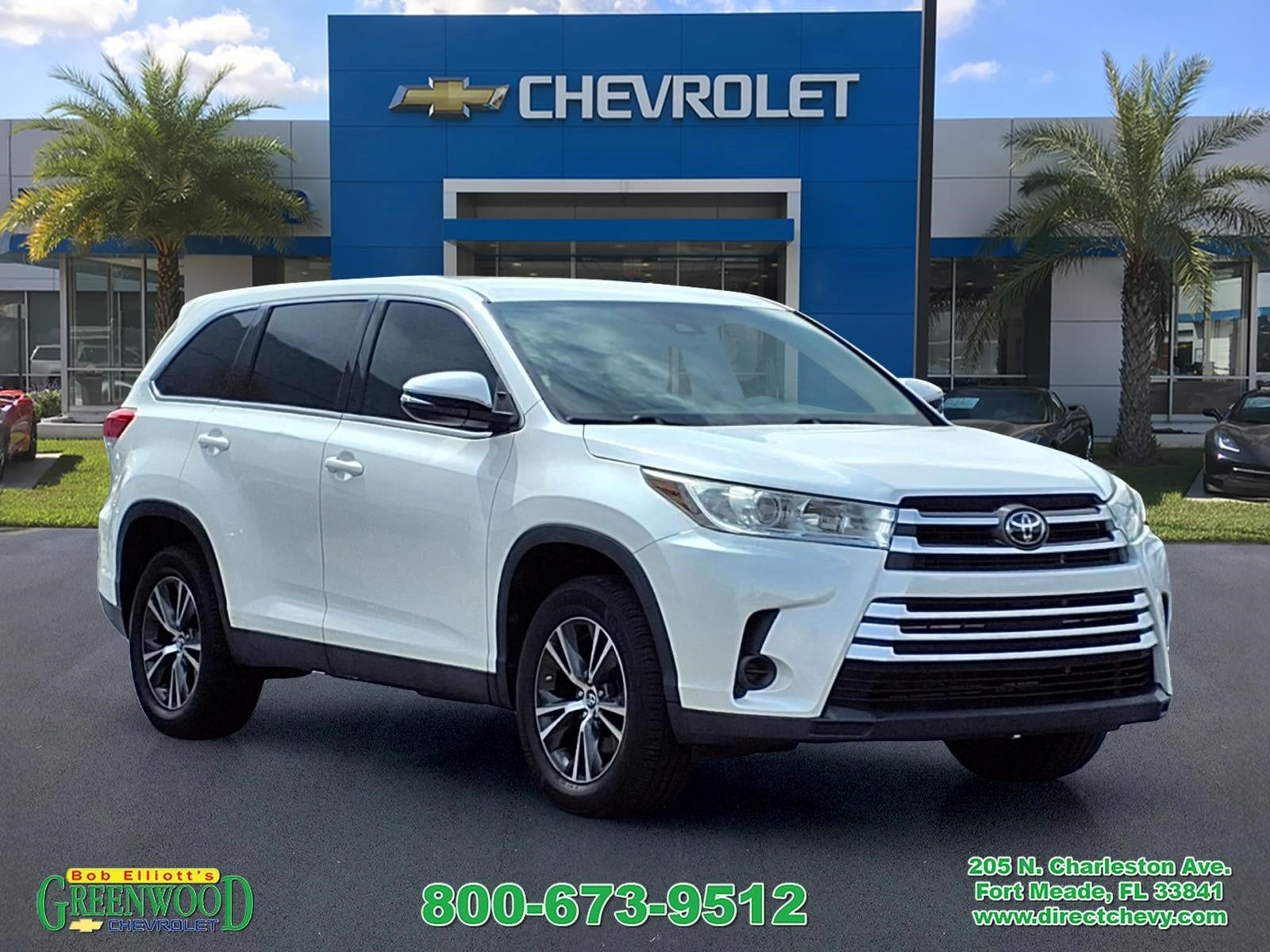 2019 Toyota Highlander LE in White — front three-quarter view